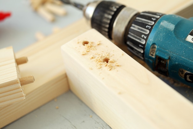 Wooden bars being drilled