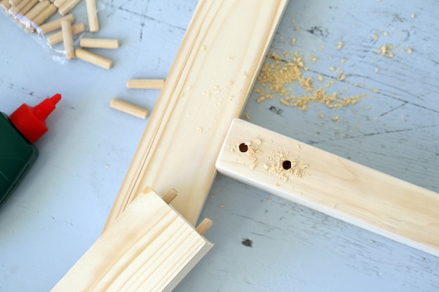 Wooden bars being drilled