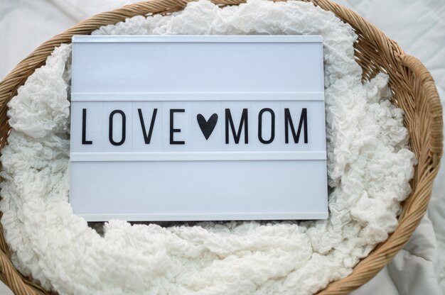 Wooden basket with fabric and mom love sign