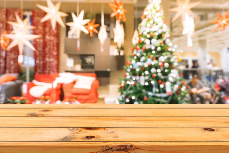 Free Photo wooden board empty table top on of blurred background. perspective brown wood table over blur christmas tree and fireplace background, can be used mock up for montage products display or design layout