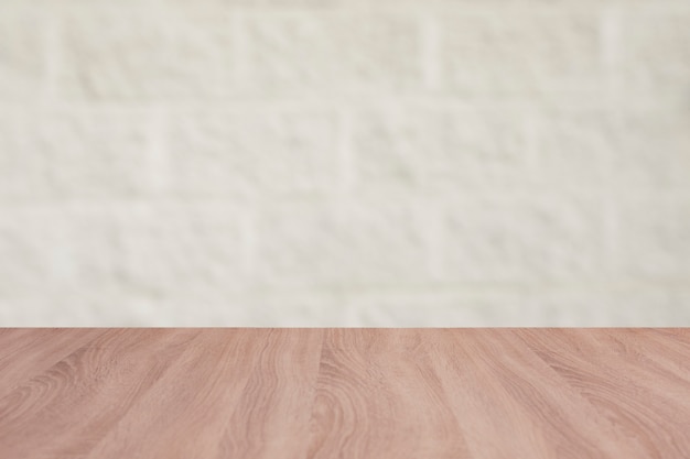 Wooden board empty table with a background of bricks