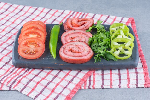 Wooden board full of delicious snacks. 