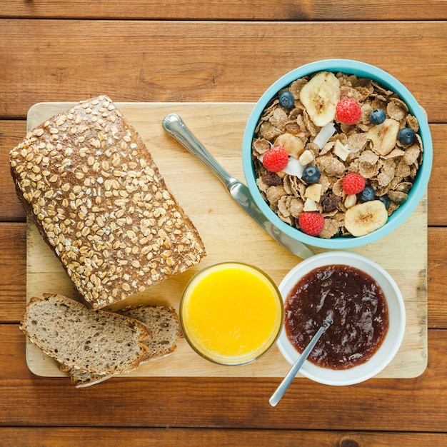 Free photo wooden board with breakfast