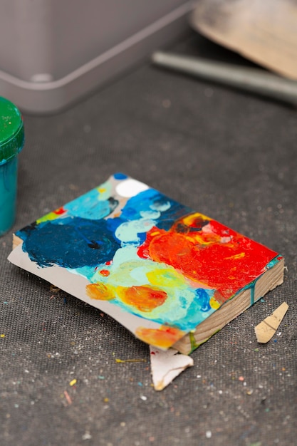 Free photo wooden board with colorful painting stains