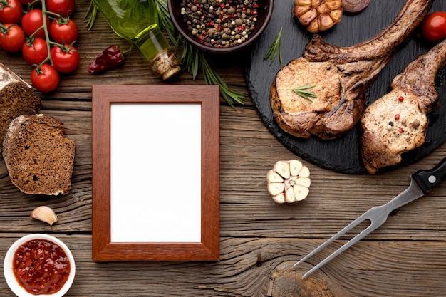 Wooden board with cooked meat and frame