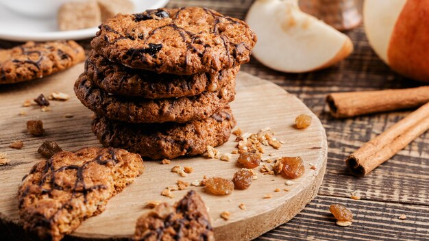 wooden board with Delicious cookies on table