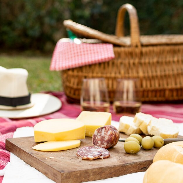 Wooden board with picnic goodies