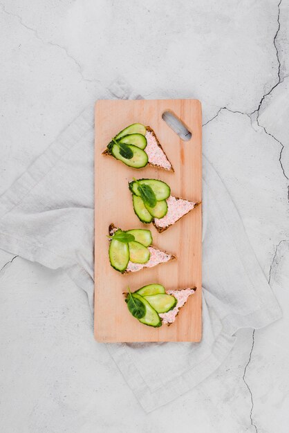 Wooden board with roe on bread