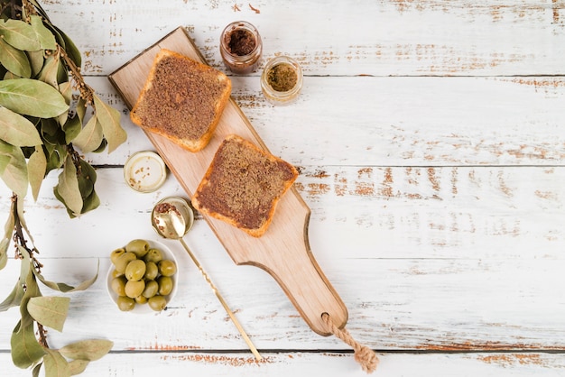 Free photo wooden board with sandwiches