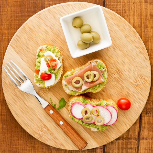 Wooden board with sandwiches