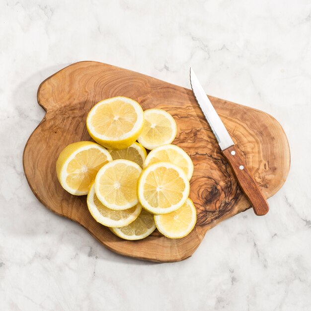 Wooden board with slices of lemon