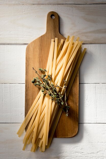 Wooden board with spaghetti