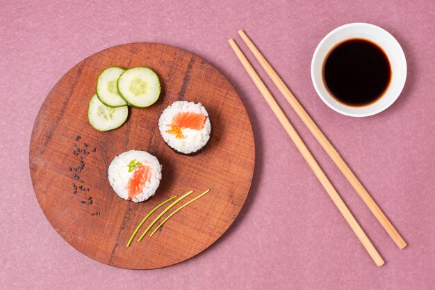 Wooden board with sushi