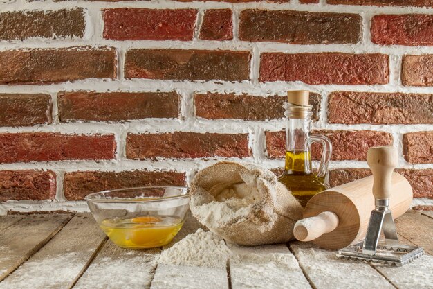 Wooden boards with flour and other pastry ingredients