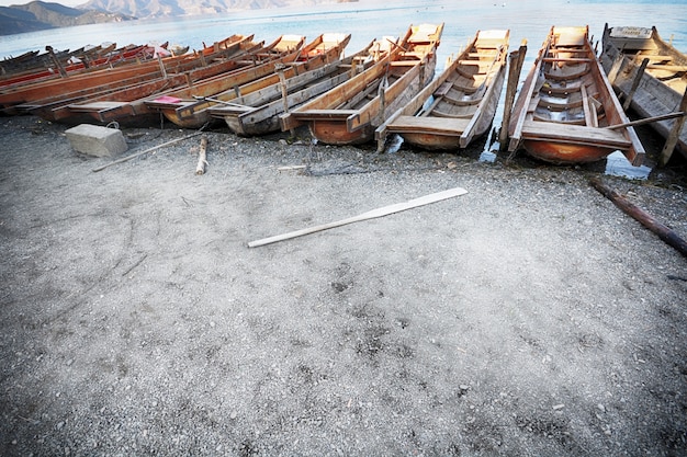 Wooden boats parked on the shore