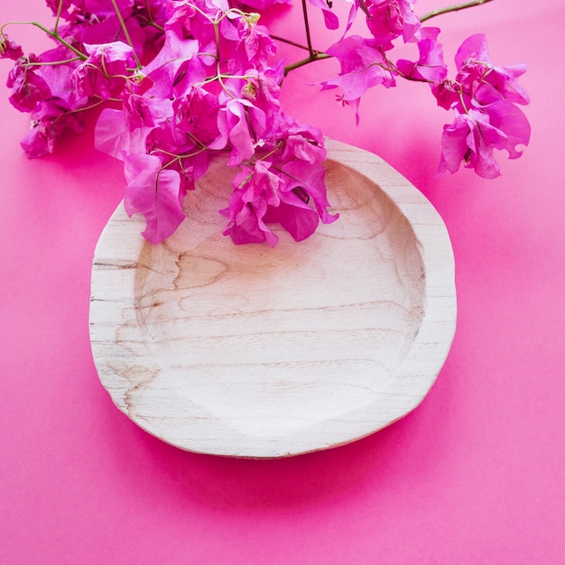 Wooden bowl and flowers