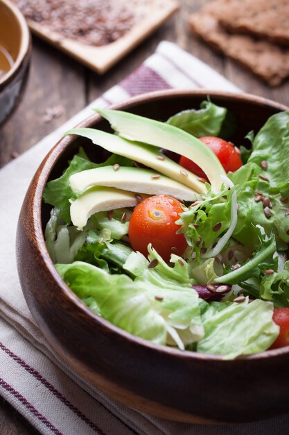 Wooden bowl with salad