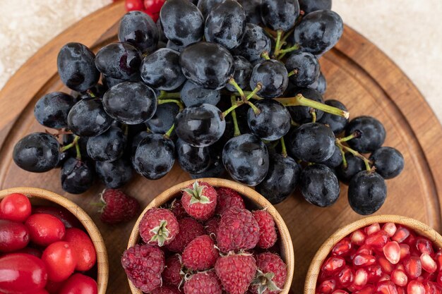 A wooden bowls full of delicious berries 