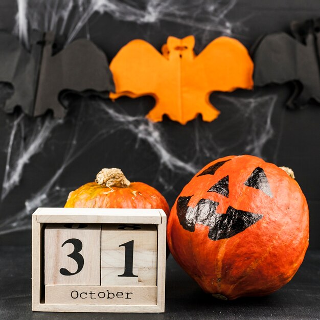 Wooden box with date and scary pumpkin