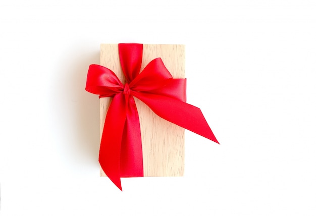 wooden box with red ribbon on white background with clipping path included