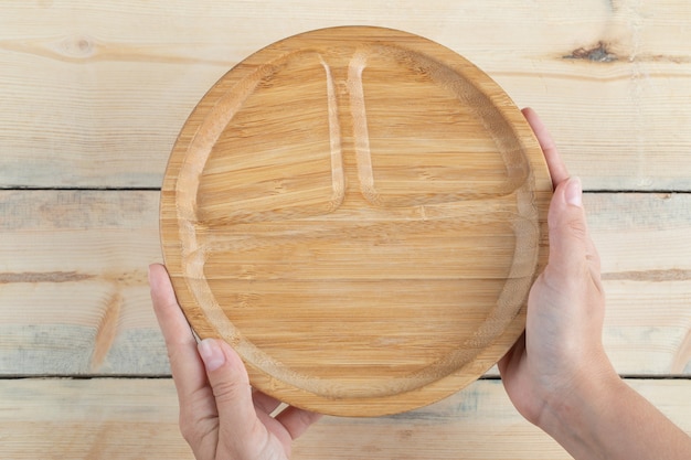 Free photo wooden breakfast platters with carved pieces inside.