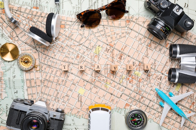 Wooden cubes surrounded by travel elements