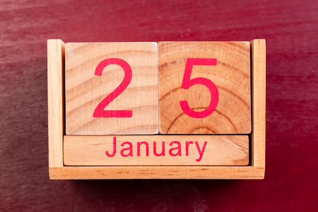 Wooden date for chinese new year on red background