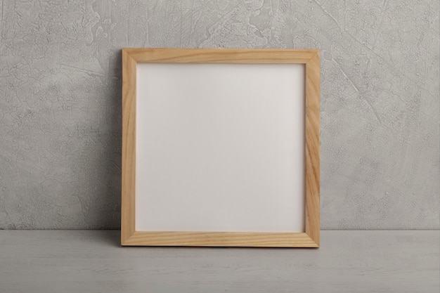 Free photo wooden empty frame front view