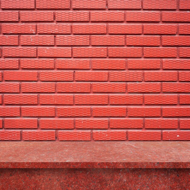 Wooden floor with brick wall