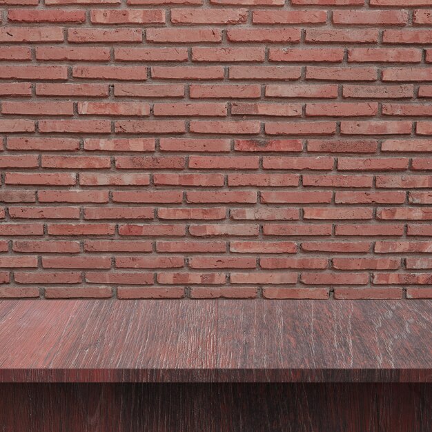 Wooden floor with brick wall