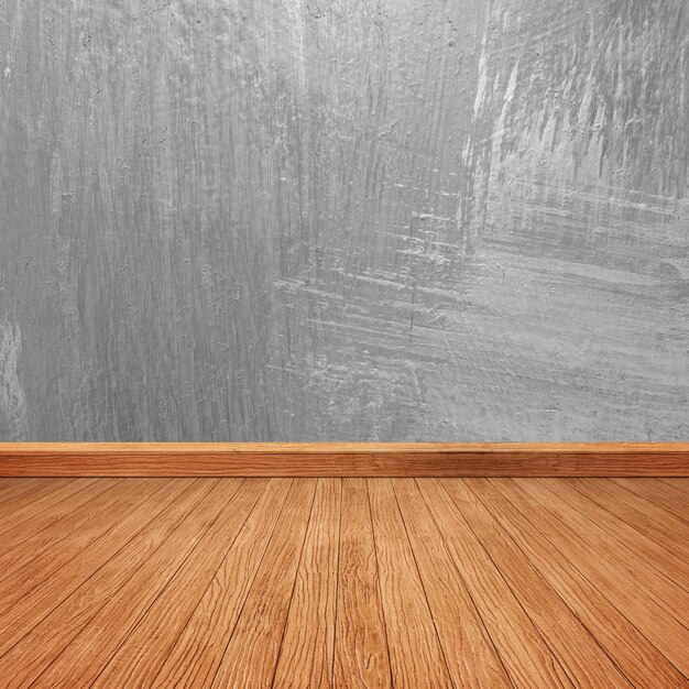 Wooden floor with a concrete wall