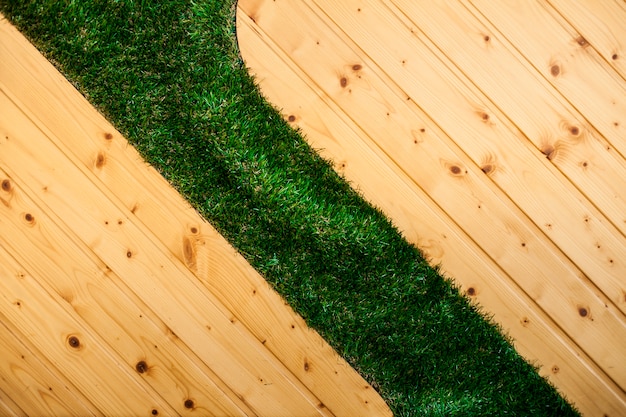 Free photo wooden floor with grass