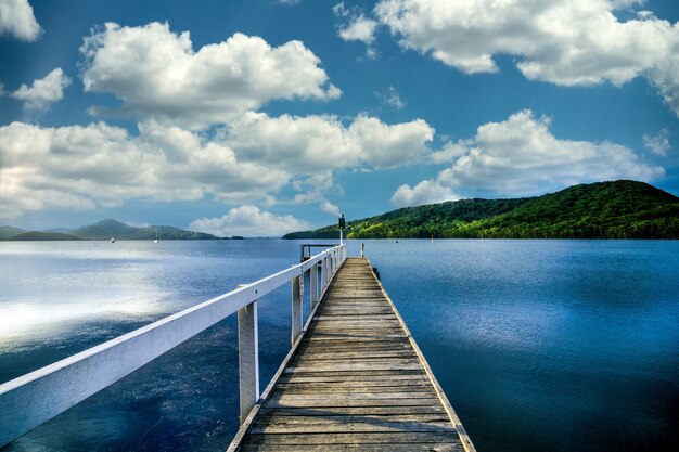 wooden footbridge leading into the lake