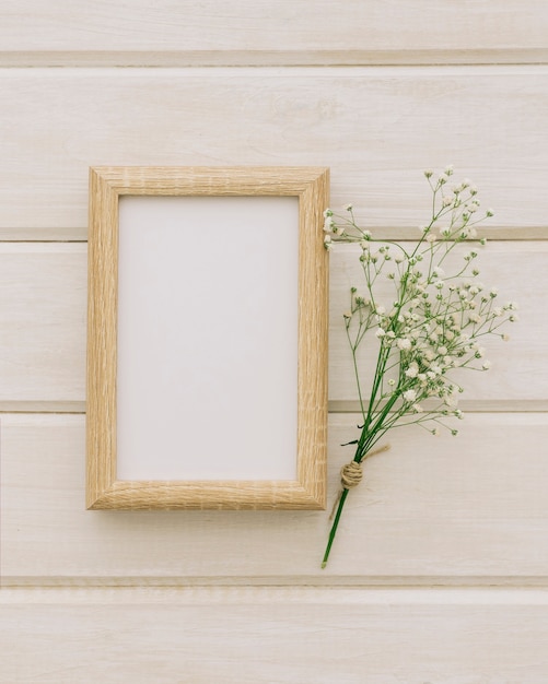 Wooden frame and bouquet of flowers