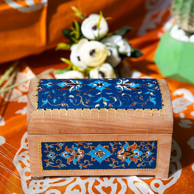 Free photo wooden gift box with blue patterns