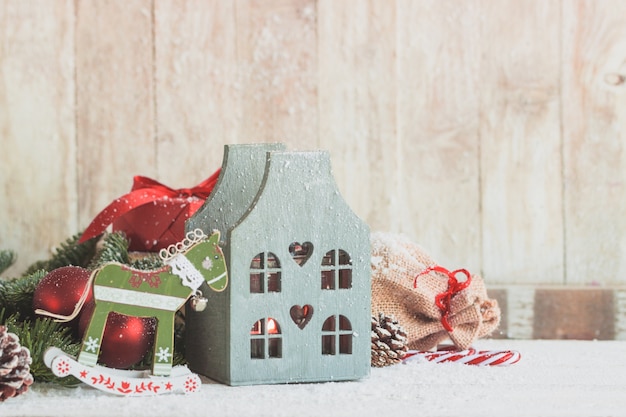 Free photo wooden house with a toy horse next to it