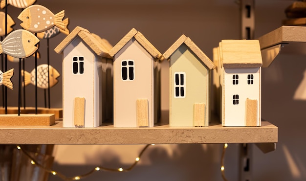 Free photo wooden houses on the shelf home decor detail