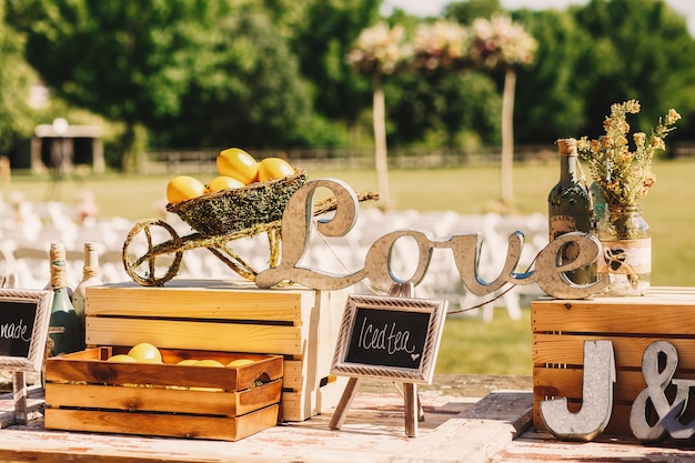 Free photo wooden letterings 'love' stand between the wooden boxes