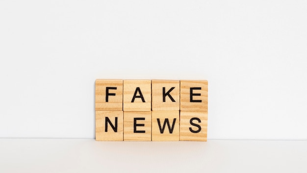 Wooden letters with fake news