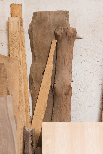 Wooden log; plank and blocks against wall