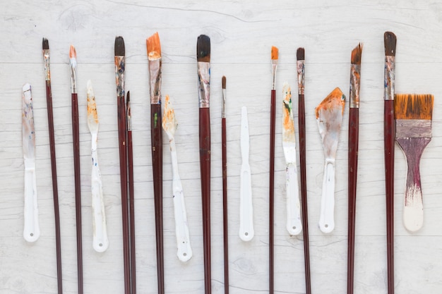Wooden paint brushes and knives for art