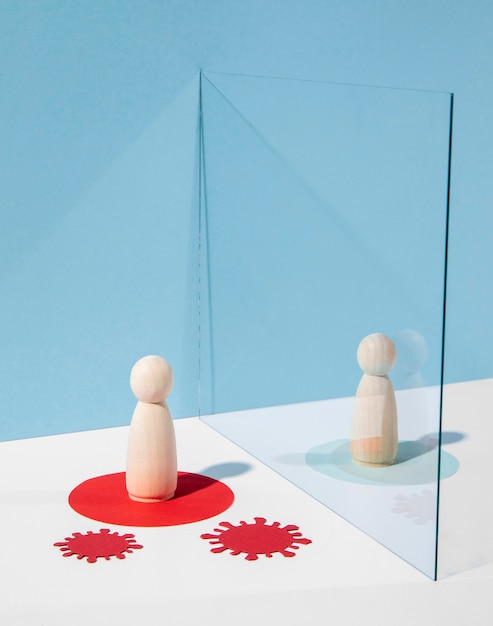 Wooden pawns with glass divider for safety against coronavirus