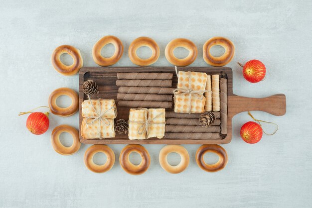 a wooden plate of round cookies on white background. high quality photo