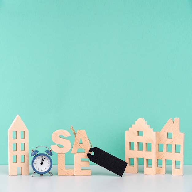 Wooden sale lettering next to wooden houses