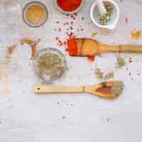 Free photo wooden spatulas near spices