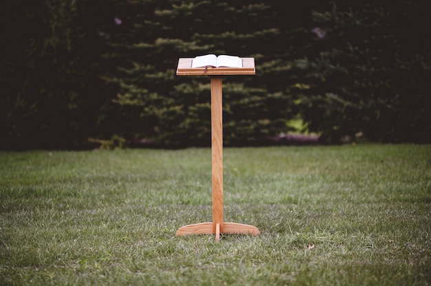 wooden speech stand with an opened book