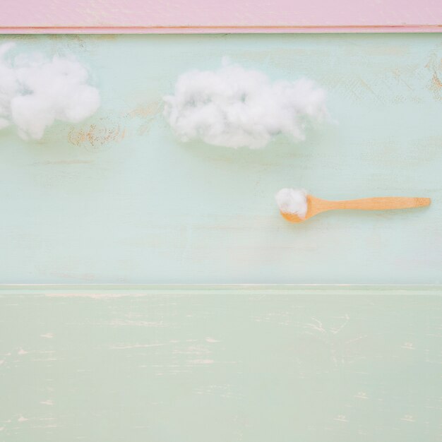 Wooden spoon and cloud on rusty wall