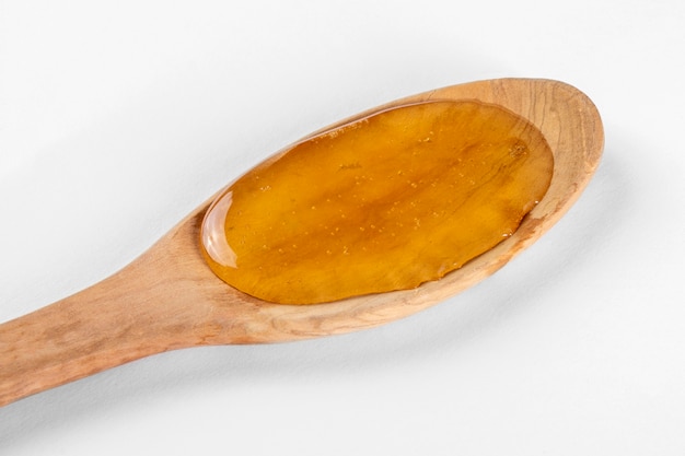 Wooden spoon with honey