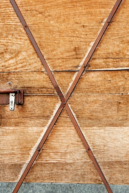 Free photo wooden structure with rusty metal strips