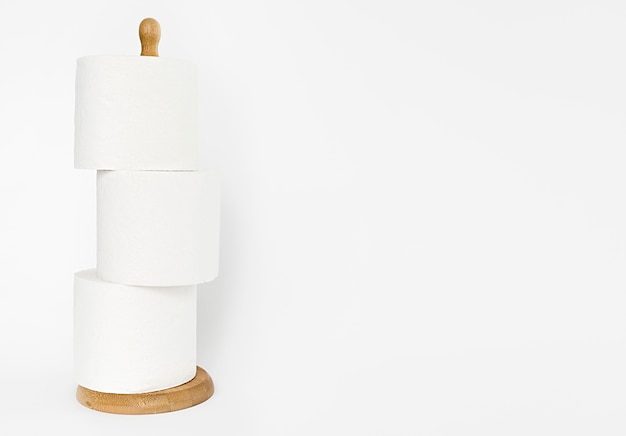 Free photo wooden support with toilet paper rolls